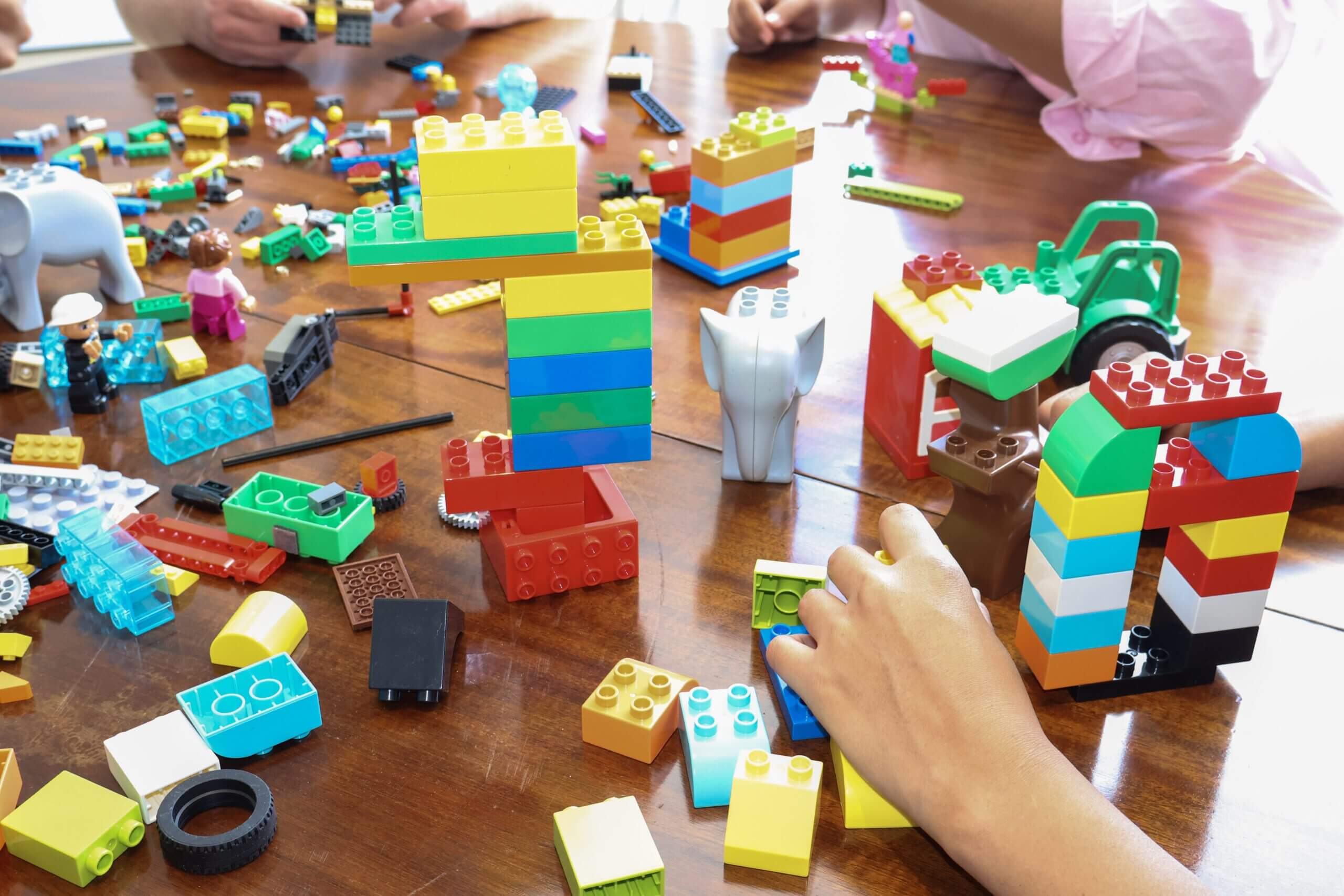 A leadership team using LEGO® SERIOUS PLAY® models in a strategic facilitation workshop.