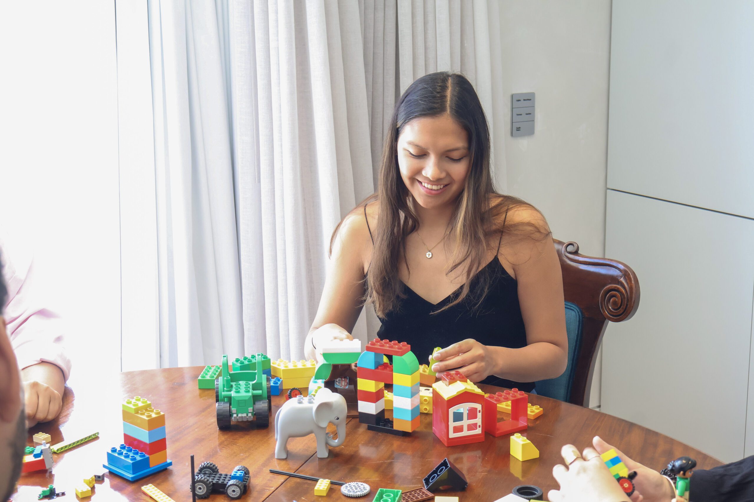 A facilitator guiding a team through a structured LEGO Serious Play session.