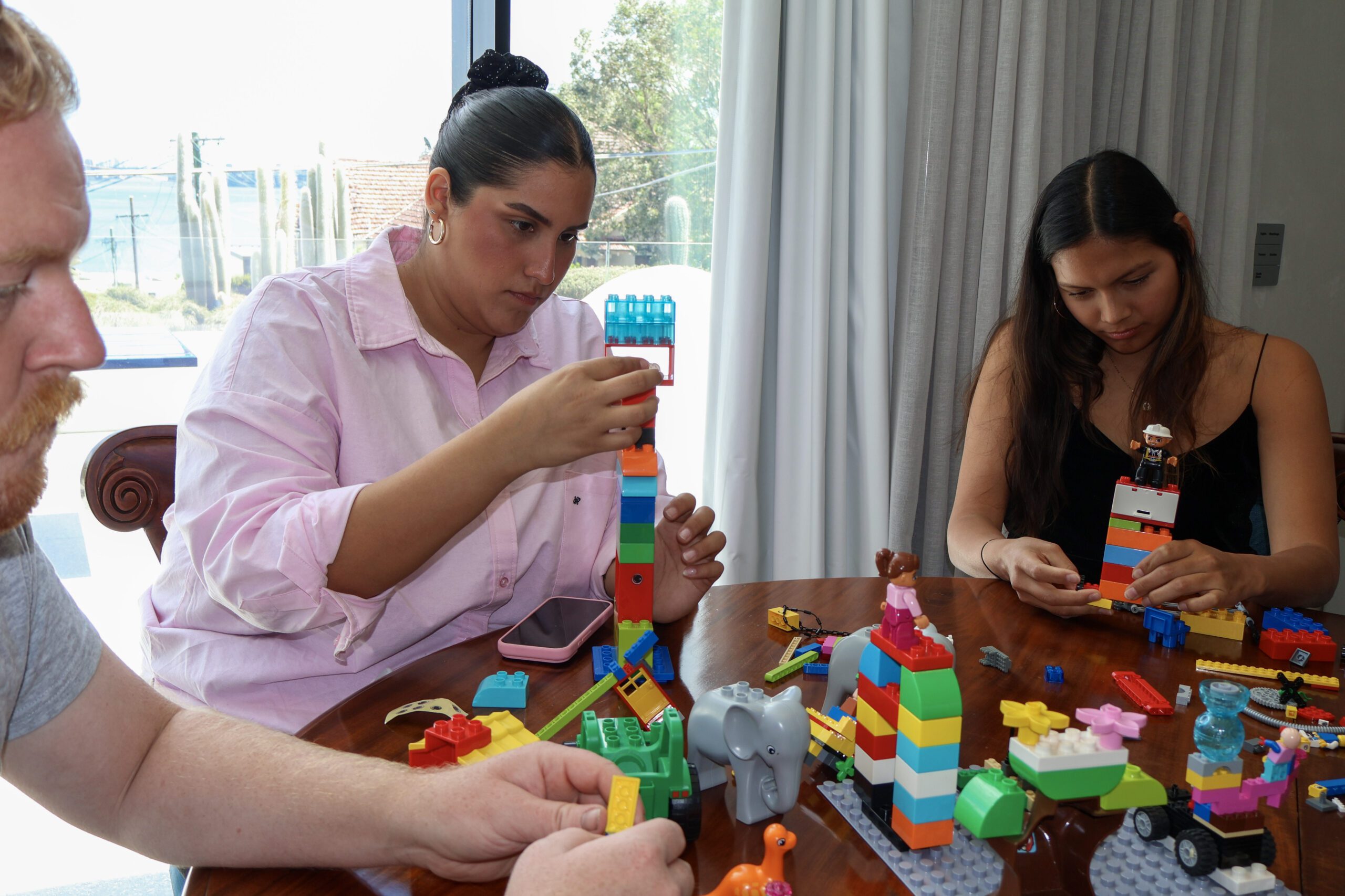 A LEGO model illustrating hidden assumptions beneath the surface of a decision.